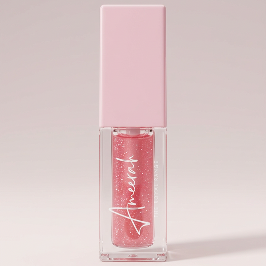 Clean product image of the Pink Me bottle with glittery pink oil on a pale pink background.